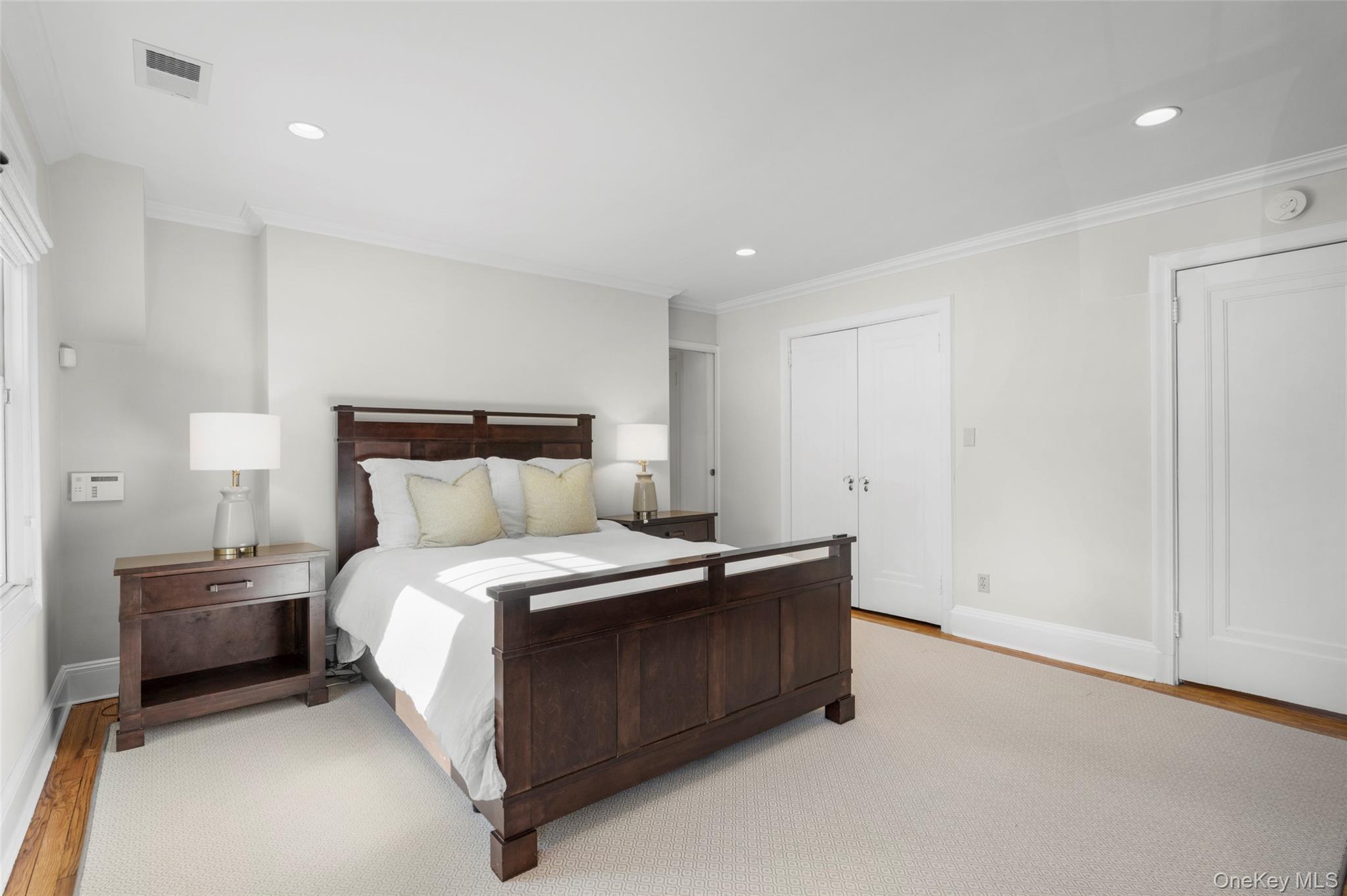 7 Poplar Road Larchmont, NY 10538 - Photo 24 of 46 a bedroom with a bed and a night stand