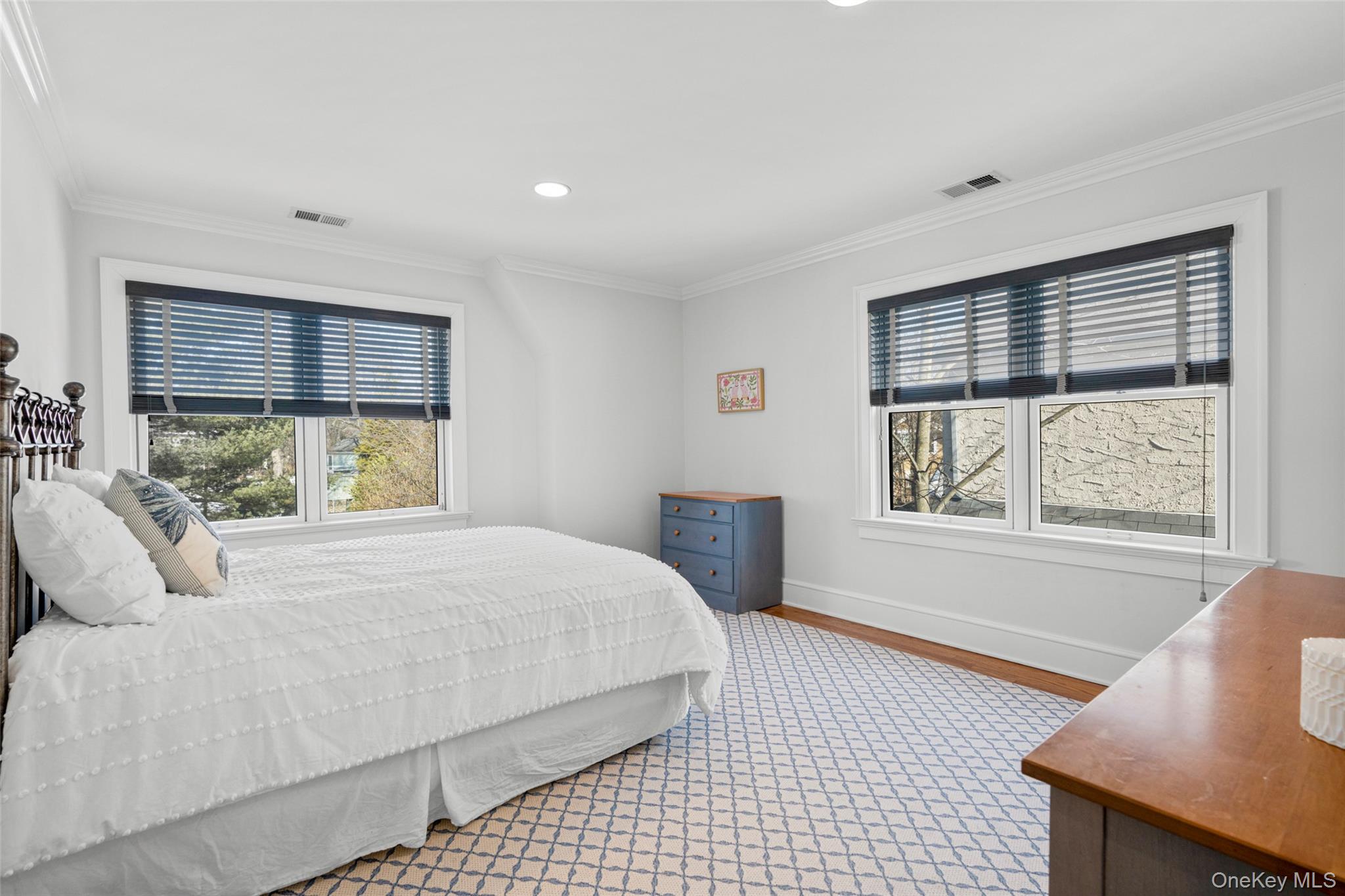 7 Poplar Road Larchmont, NY 10538 - Photo 28 of 46 a bedroom with a large bed and a window