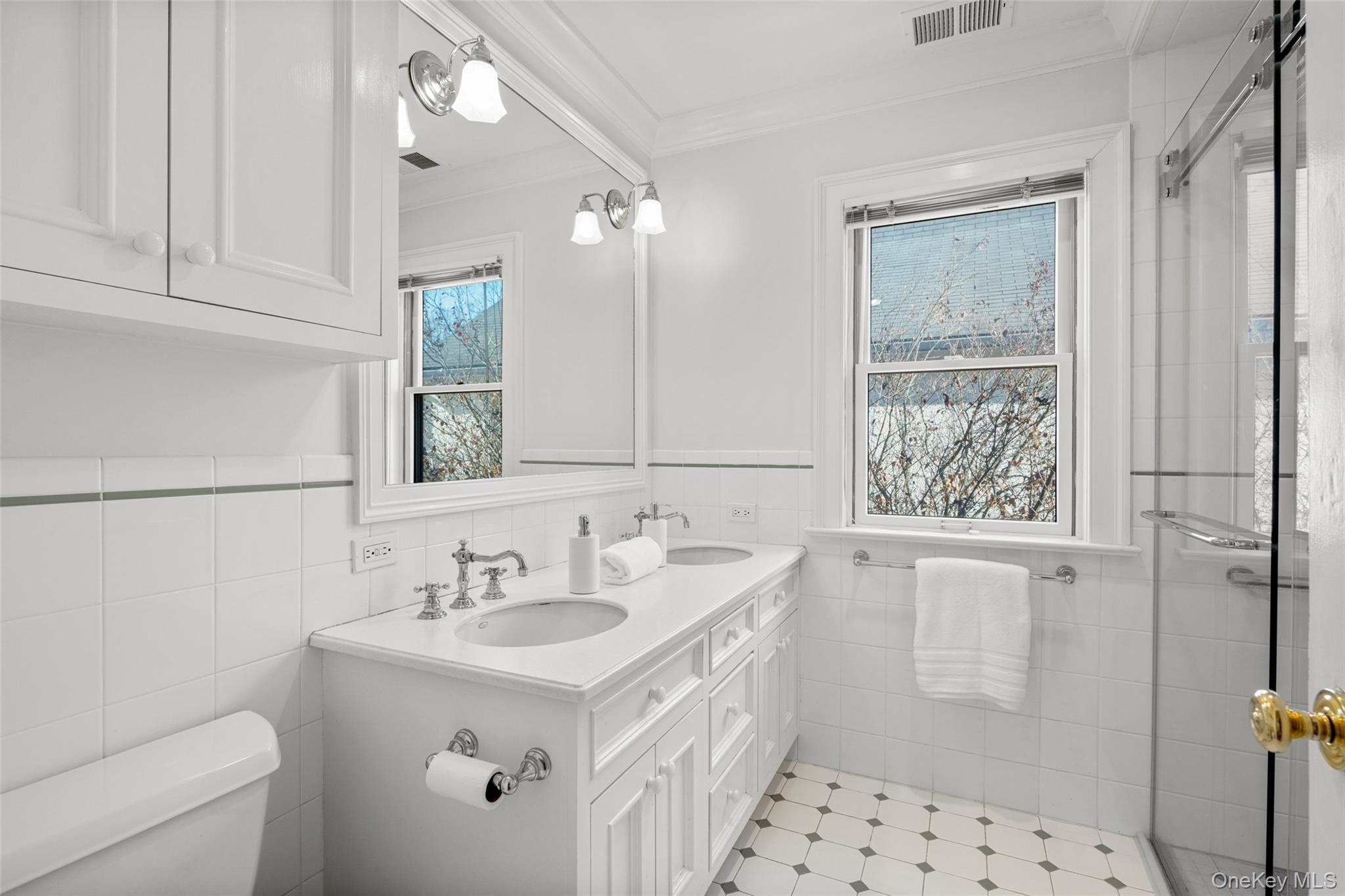 7 Poplar Road Larchmont, NY 10538 - Photo 30 of 46 a bathroom with a sink a toilet and shower