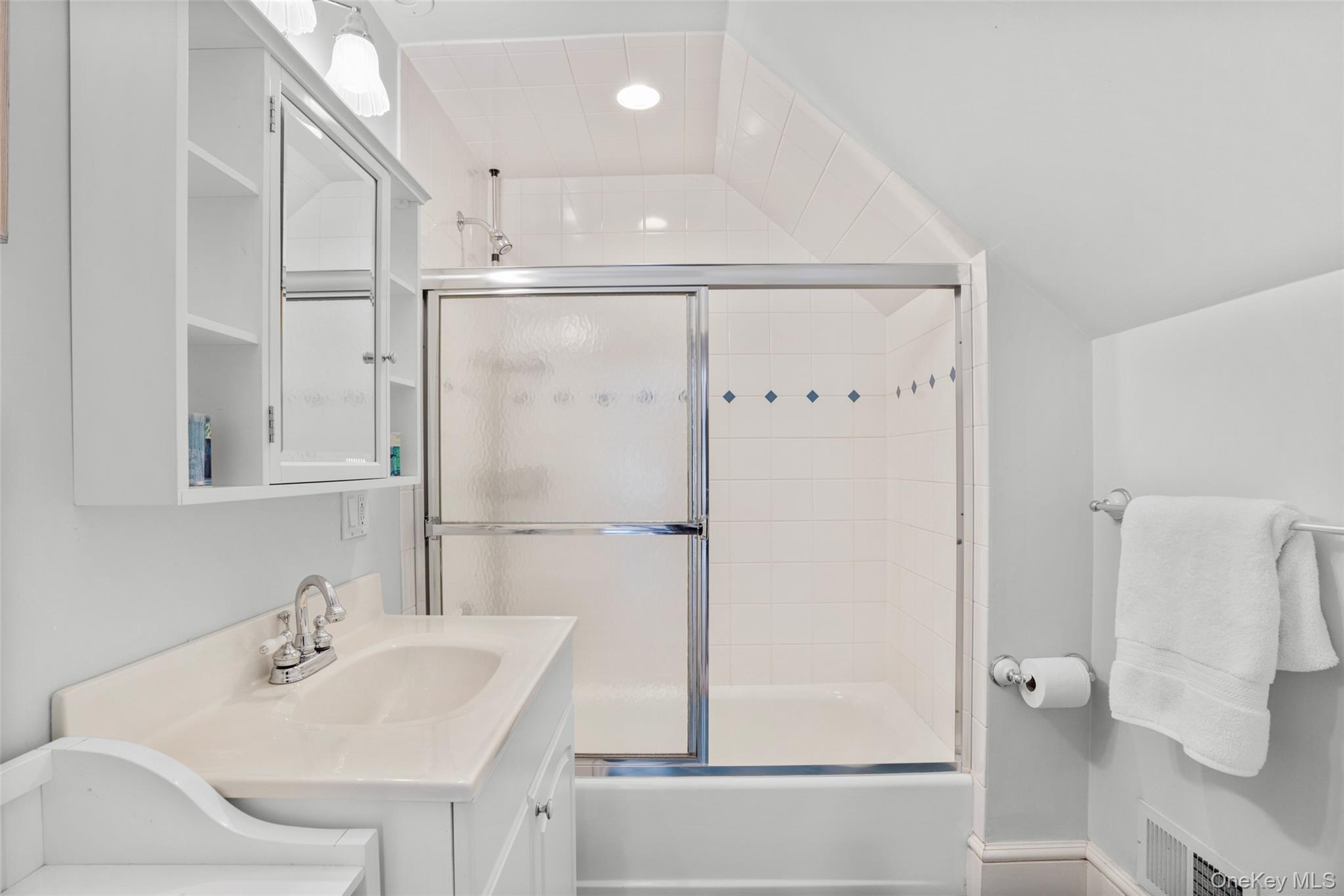 7 Poplar Road Larchmont, NY 10538 - Photo 33 of 46 a bathroom with a sink shower and a mirror