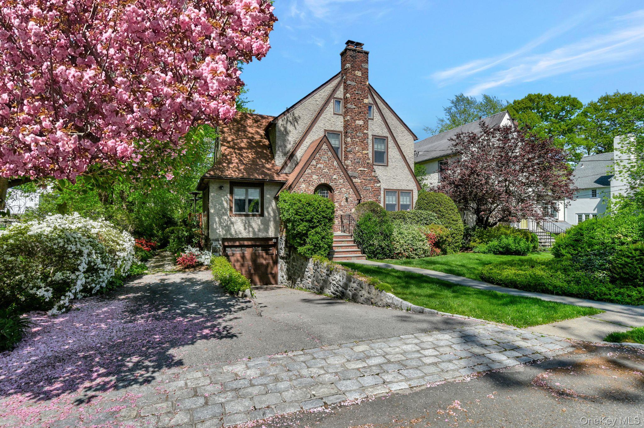 7 Poplar Road Larchmont, NY 10538 - Photo 39 of 46 a front view of a house with garden