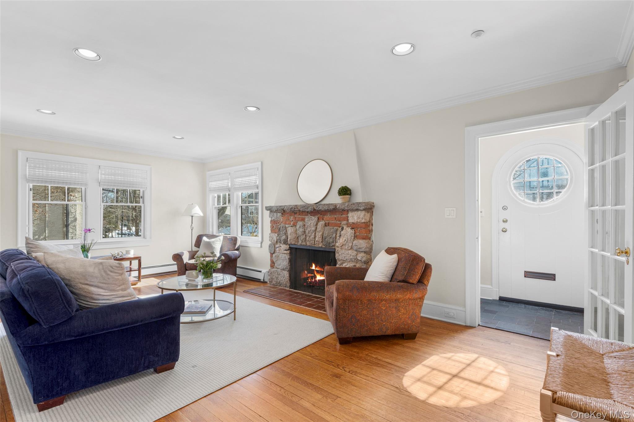 7 Poplar Road Larchmont, NY 10538 - Photo 4 of 46 a living room with furniture and a fireplace
