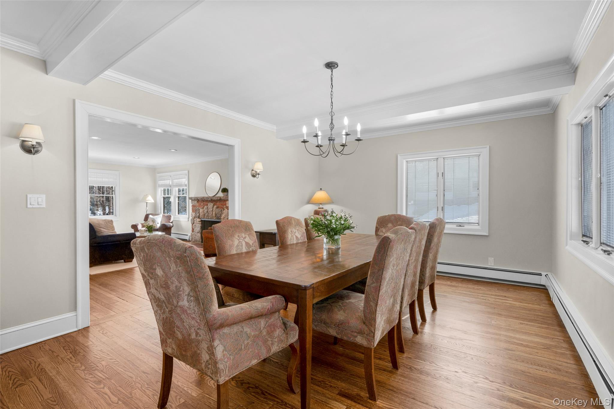 7 Poplar Road Larchmont, NY 10538 - Photo 8 of 46 a view of a dining room with furniture a chandelier and wooden floor