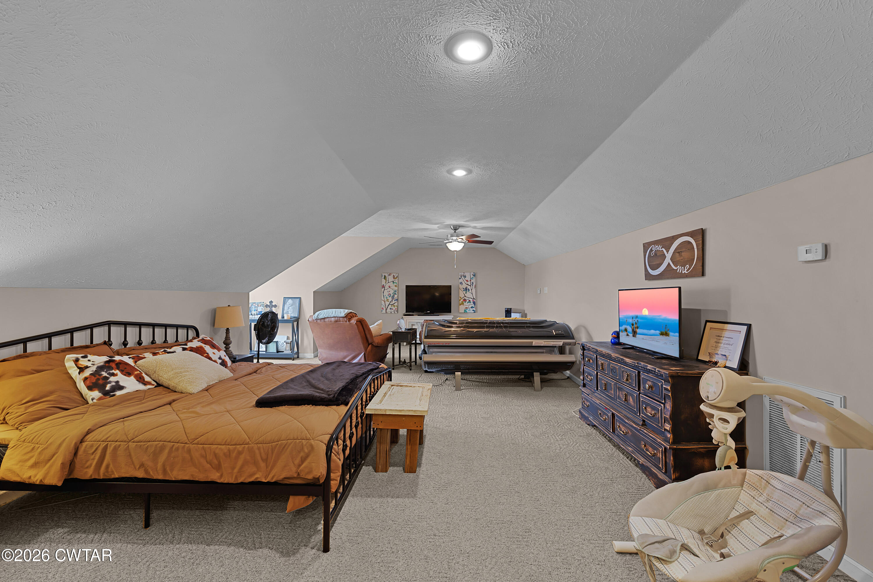 296 Broad Street North Lexington, TN 38351 - Photo 12 of 26 a spacious bedroom with a bed and furniture