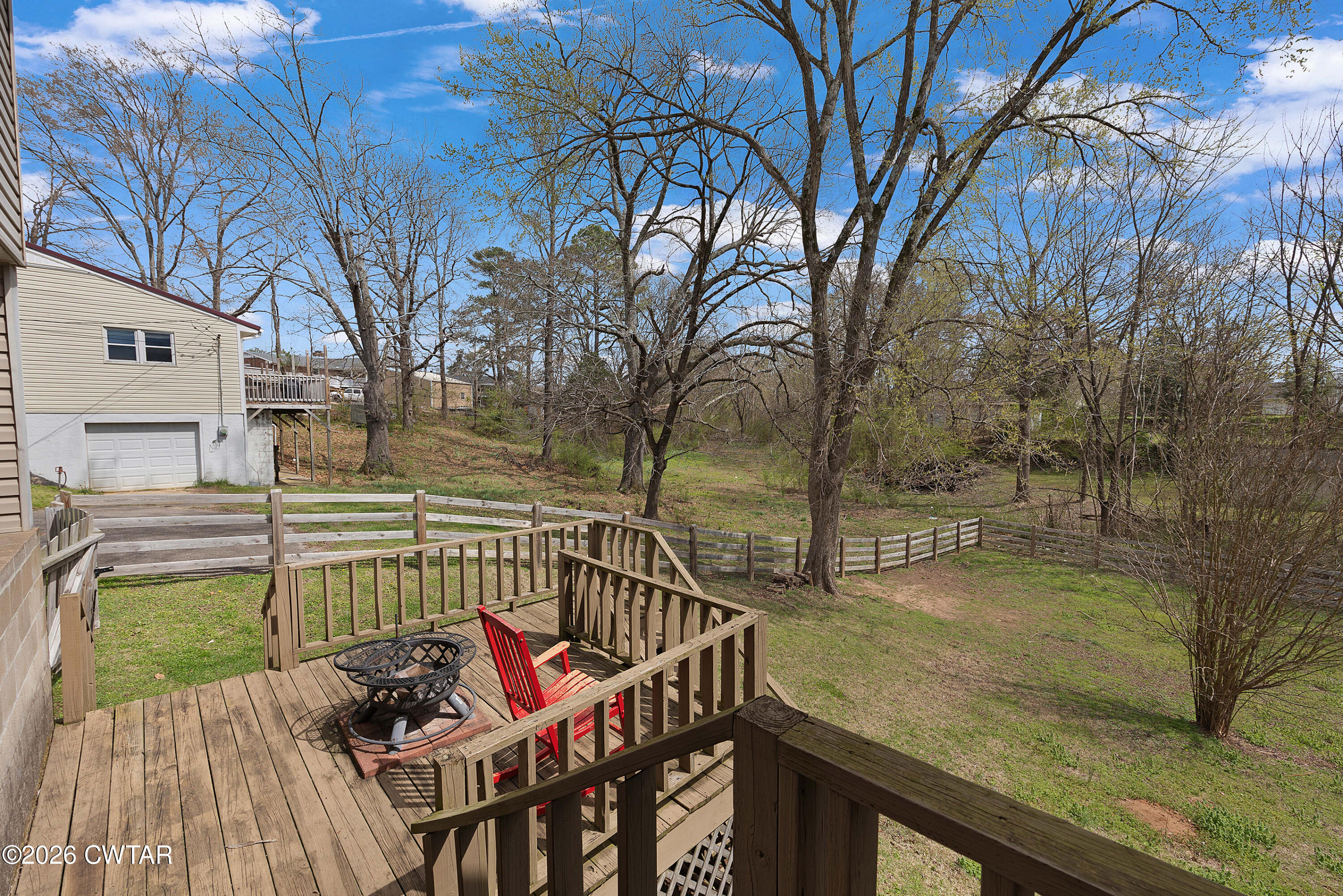 296 Broad Street North Lexington, TN 38351 - Photo 23 of 26 a view of a roof deck with couches and wooden fence