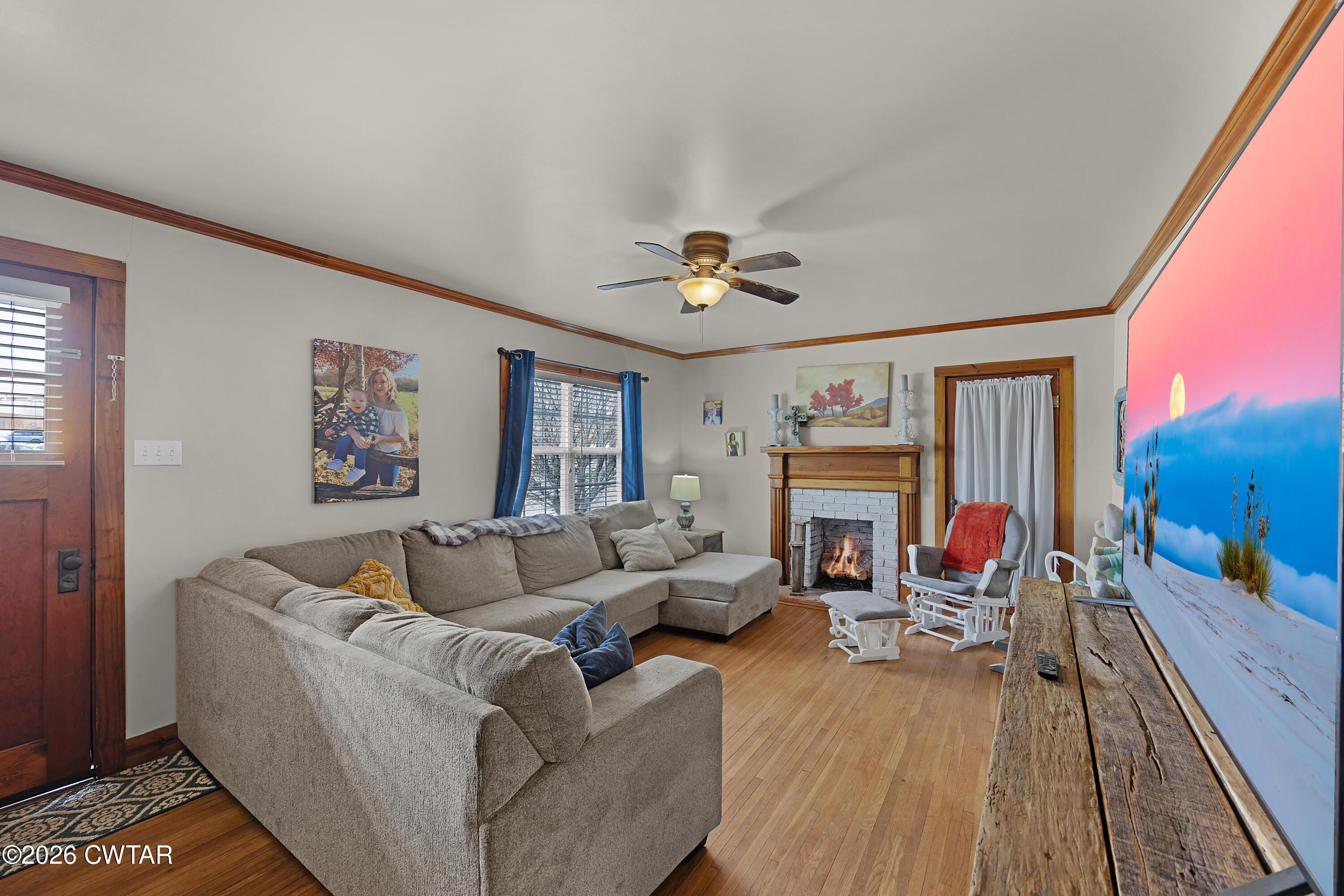 296 Broad Street North Lexington, TN 38351 - Photo 3 of 26 a living room with furniture and a fireplace