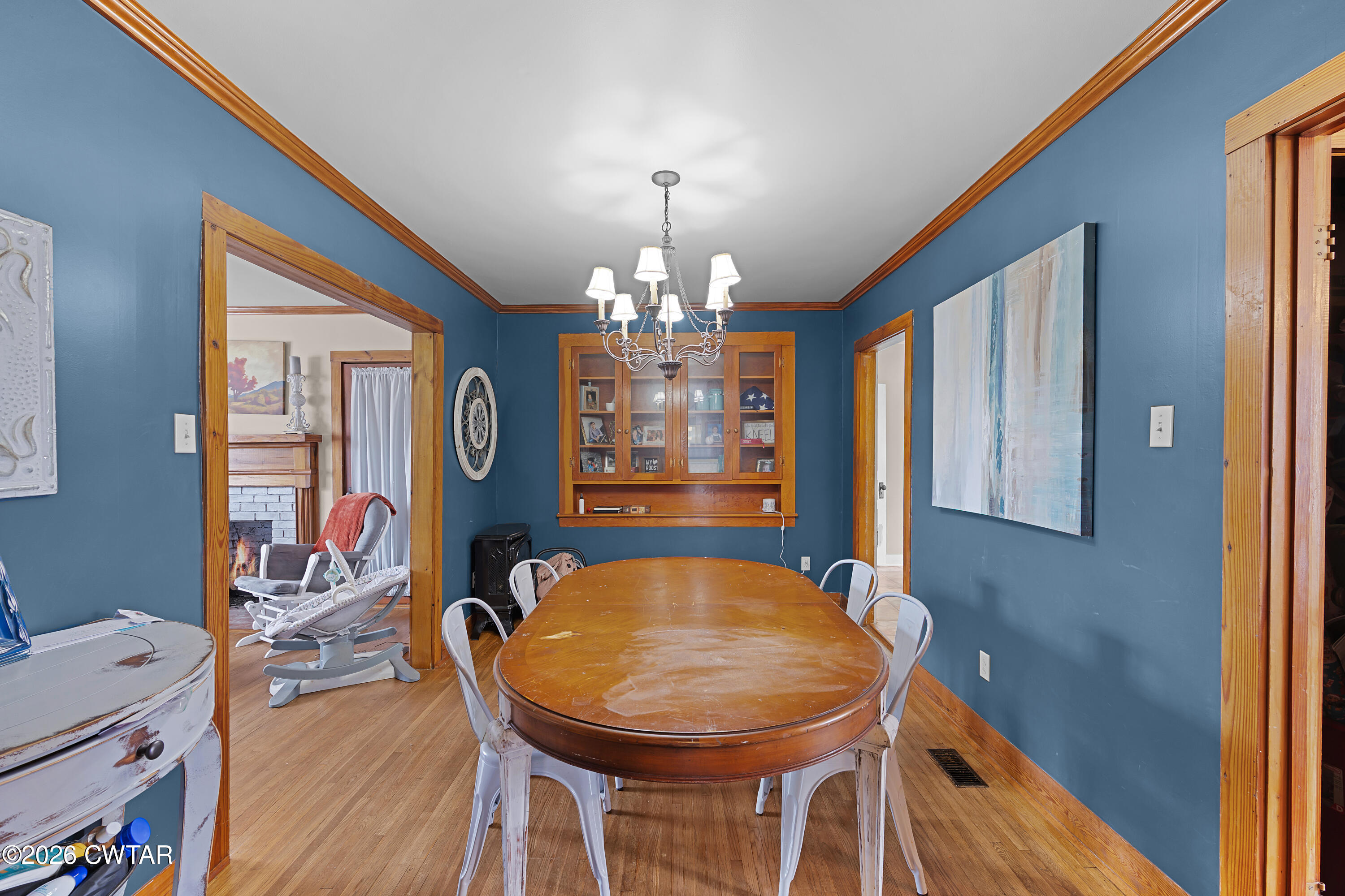 296 Broad Street North Lexington, TN 38351 - Photo 5 of 26 a view of a dining room with furniture and chandelier