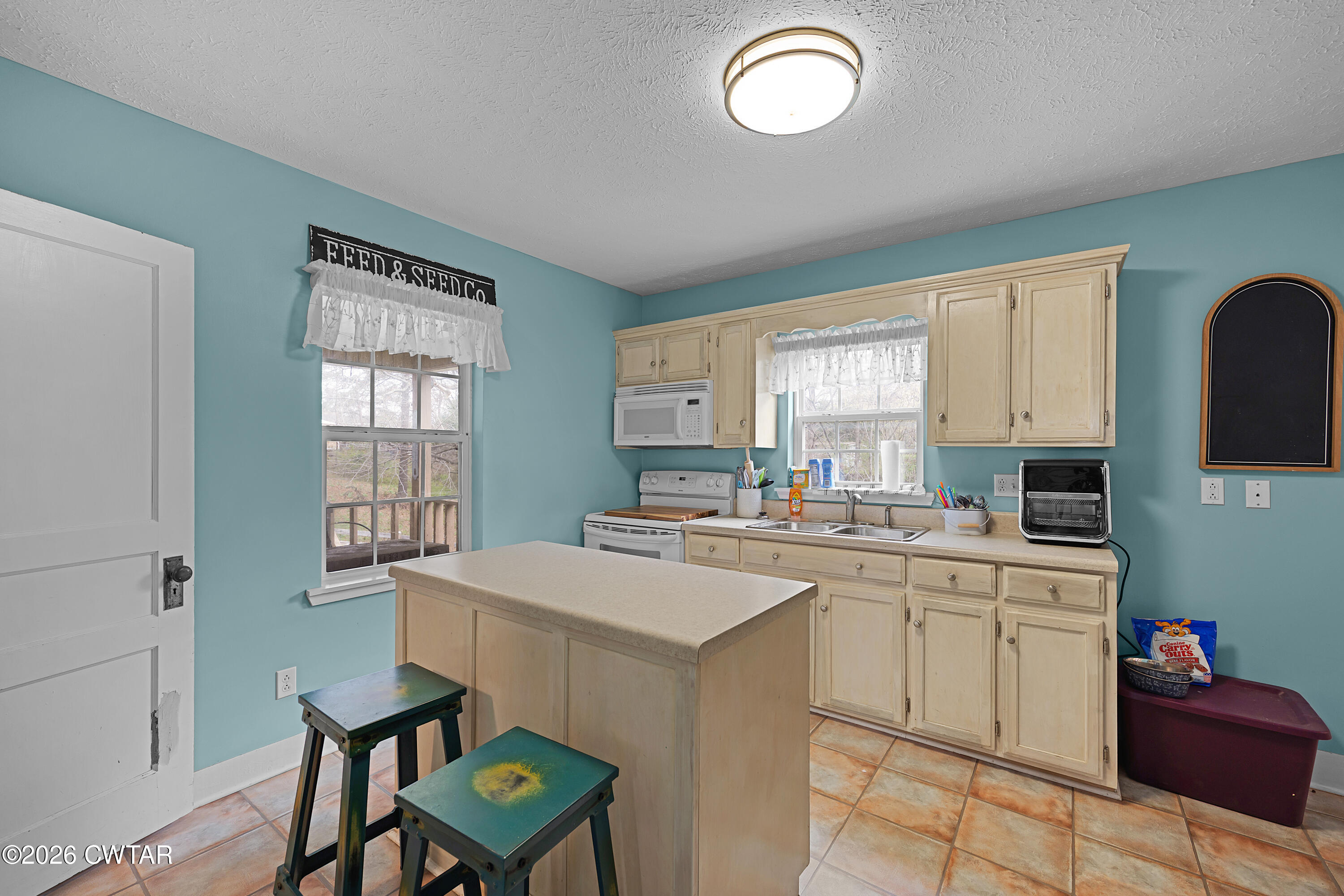 296 Broad Street North Lexington, TN 38351 - Photo 7 of 26 a kitchen with a sink stove and cabinets