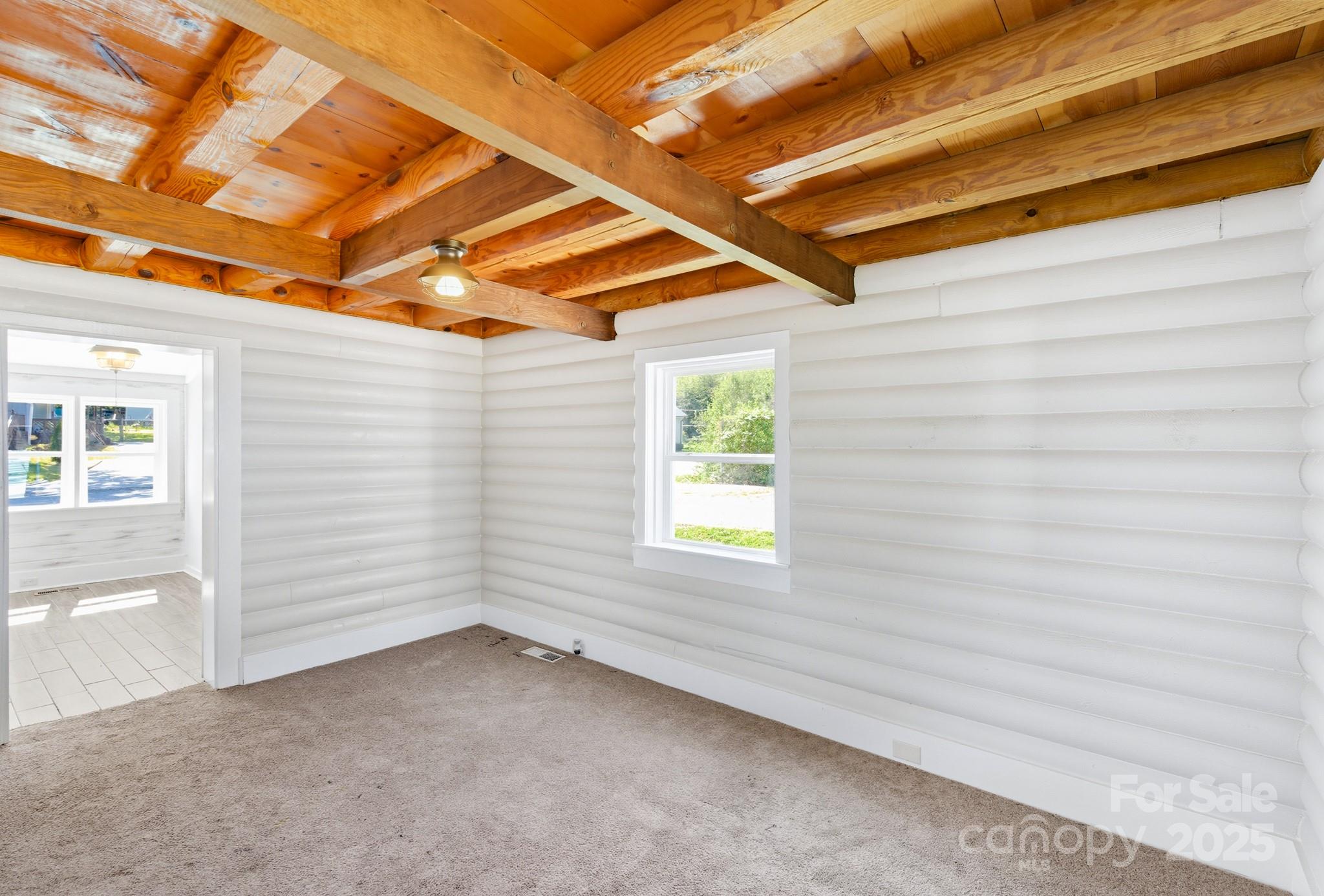 119 Yates Street Dallas, NC 28034 - Photo 17 of 47 a view of a room with a white bed and a windows