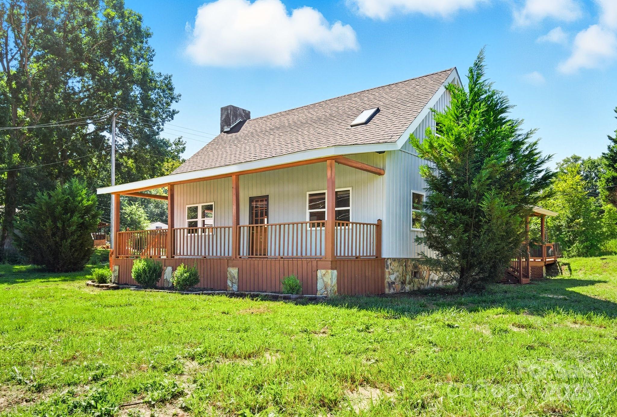 119 Yates Street Dallas, NC 28034 - Photo 2 of 47 a view of a house with backyard and garden