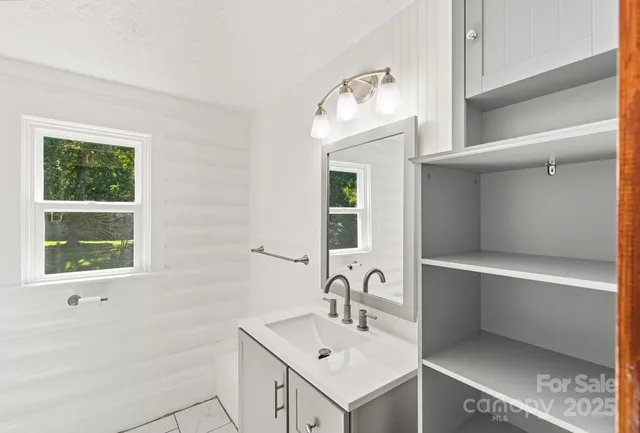 a bathroom with a sink and a mirror