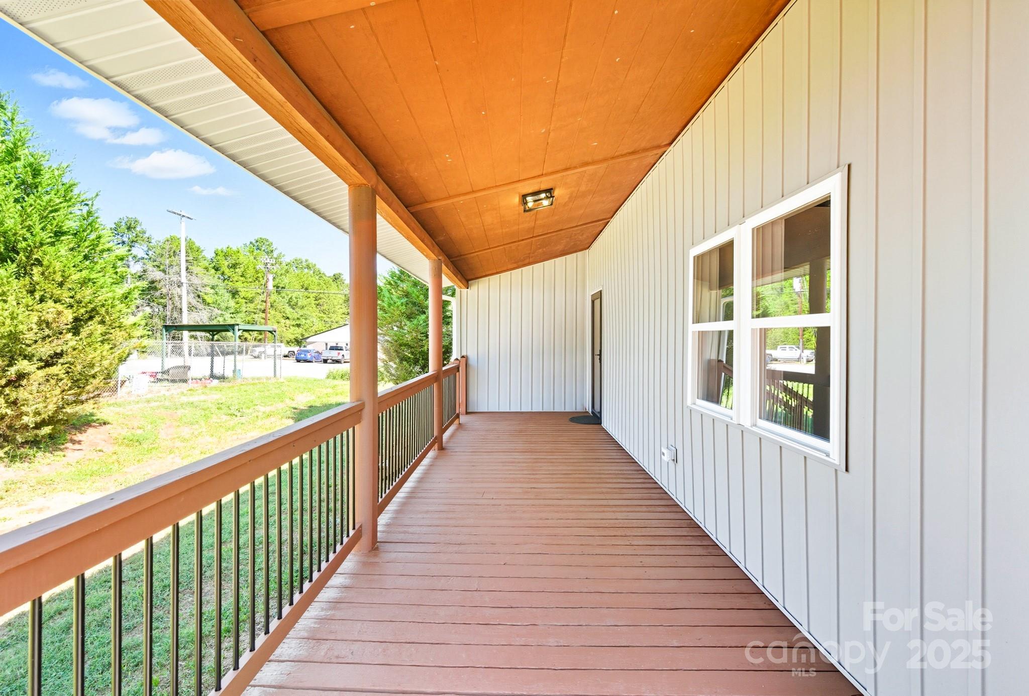 119 Yates Street Dallas, NC 28034 - Photo 41 of 47 a view of a balcony with wooden floor