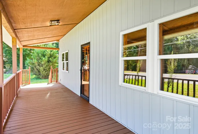 a view of a house with porch and wooden floor