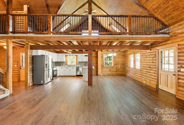 a view of a hall with wooden floor