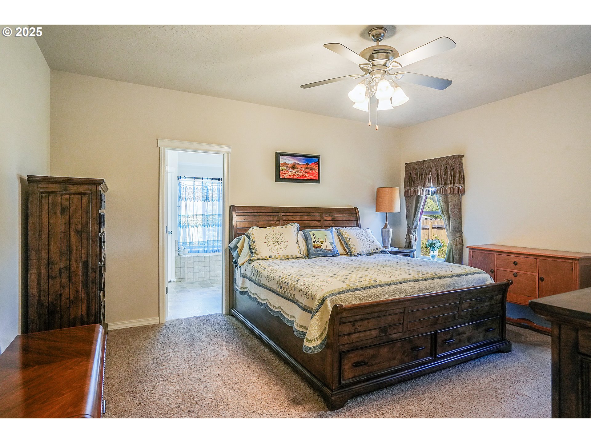 1231 Southwest 3rd Avenue Mill City, OR 97360 - Photo 26 of 48 a bedroom with a bed and a ceiling fan