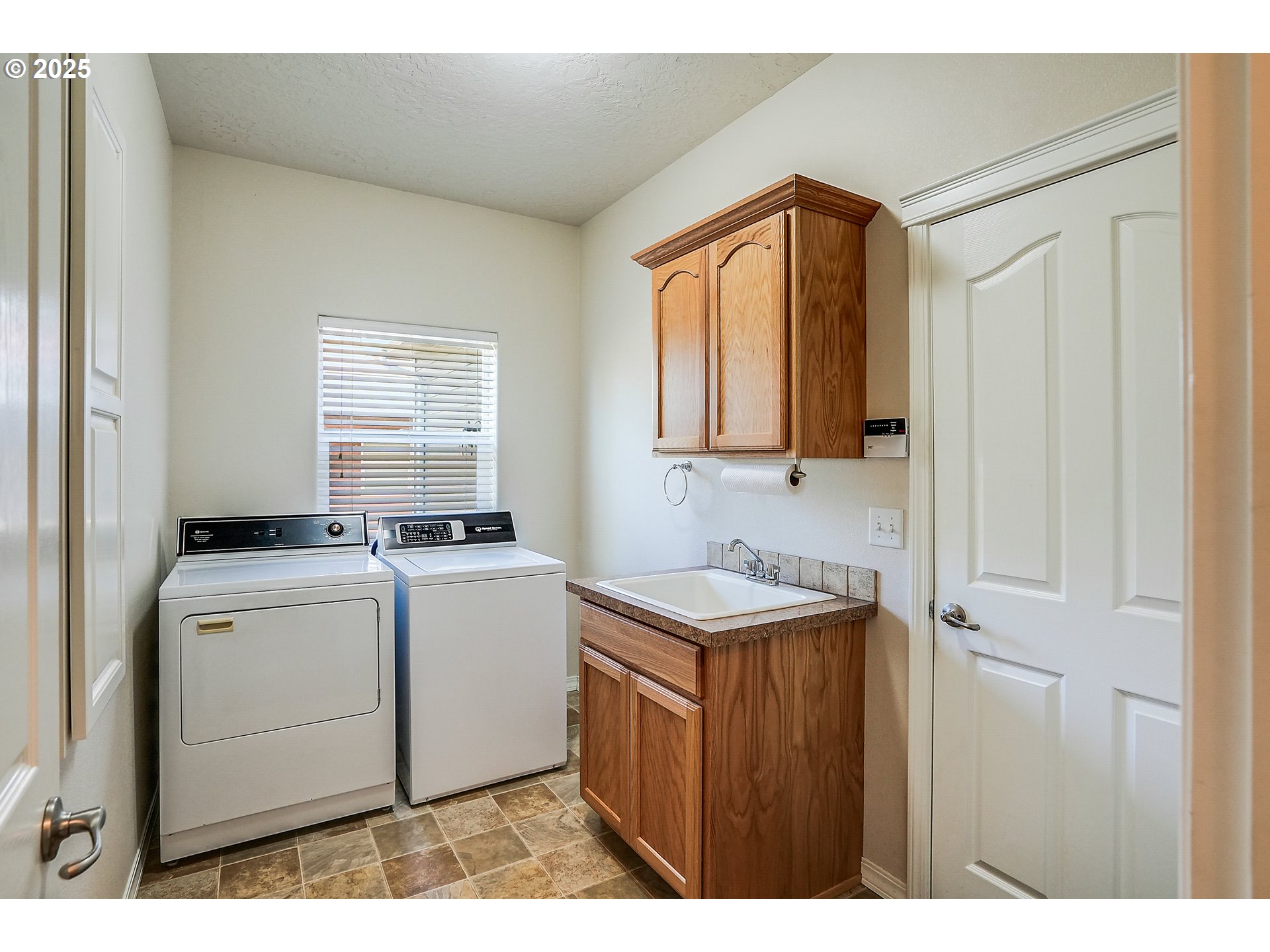 1231 Southwest 3rd Avenue Mill City, OR 97360 - Photo 32 of 48 a utility room with cabinets washer and dryer