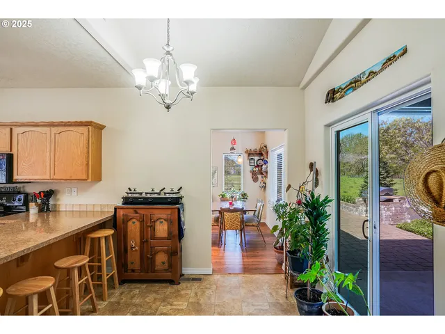 a view of a entryway kitchen and dining room view