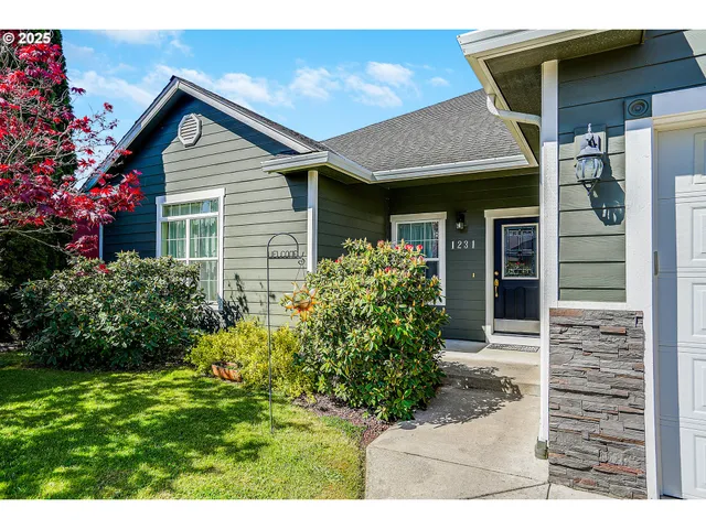 a front view of a house with garden