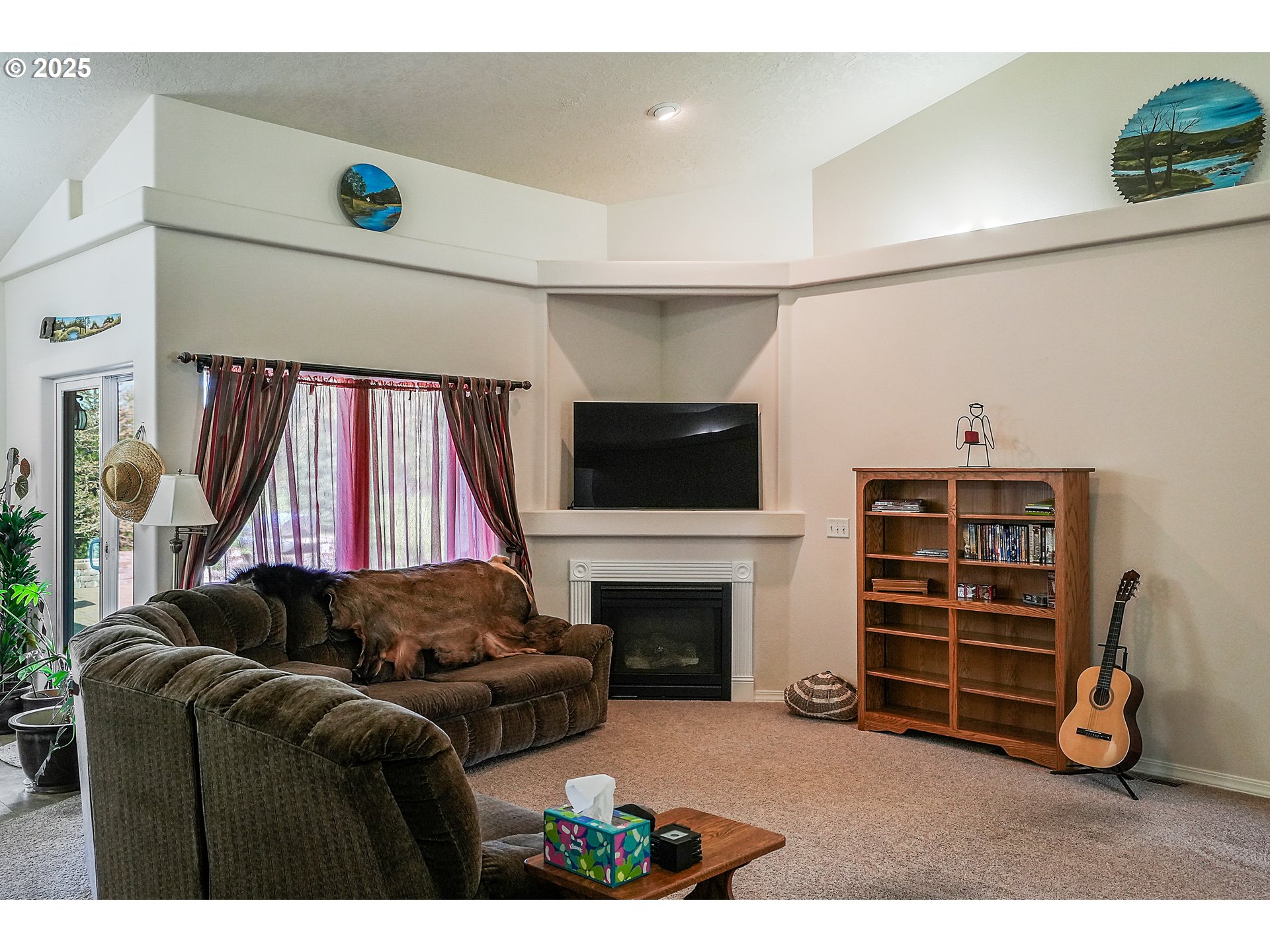 1231 Southwest 3rd Avenue Mill City, OR 97360 - Photo 10 of 48 a living room with furniture a flat screen tv and a fireplace