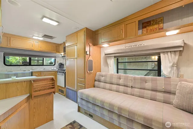 a living room with furniture and a window
