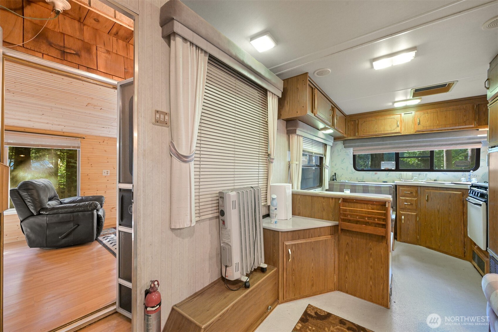 1189 Exit Road Maple Falls, WA 98266 - Photo 16 of 40 a view of a living room with furniture and a window