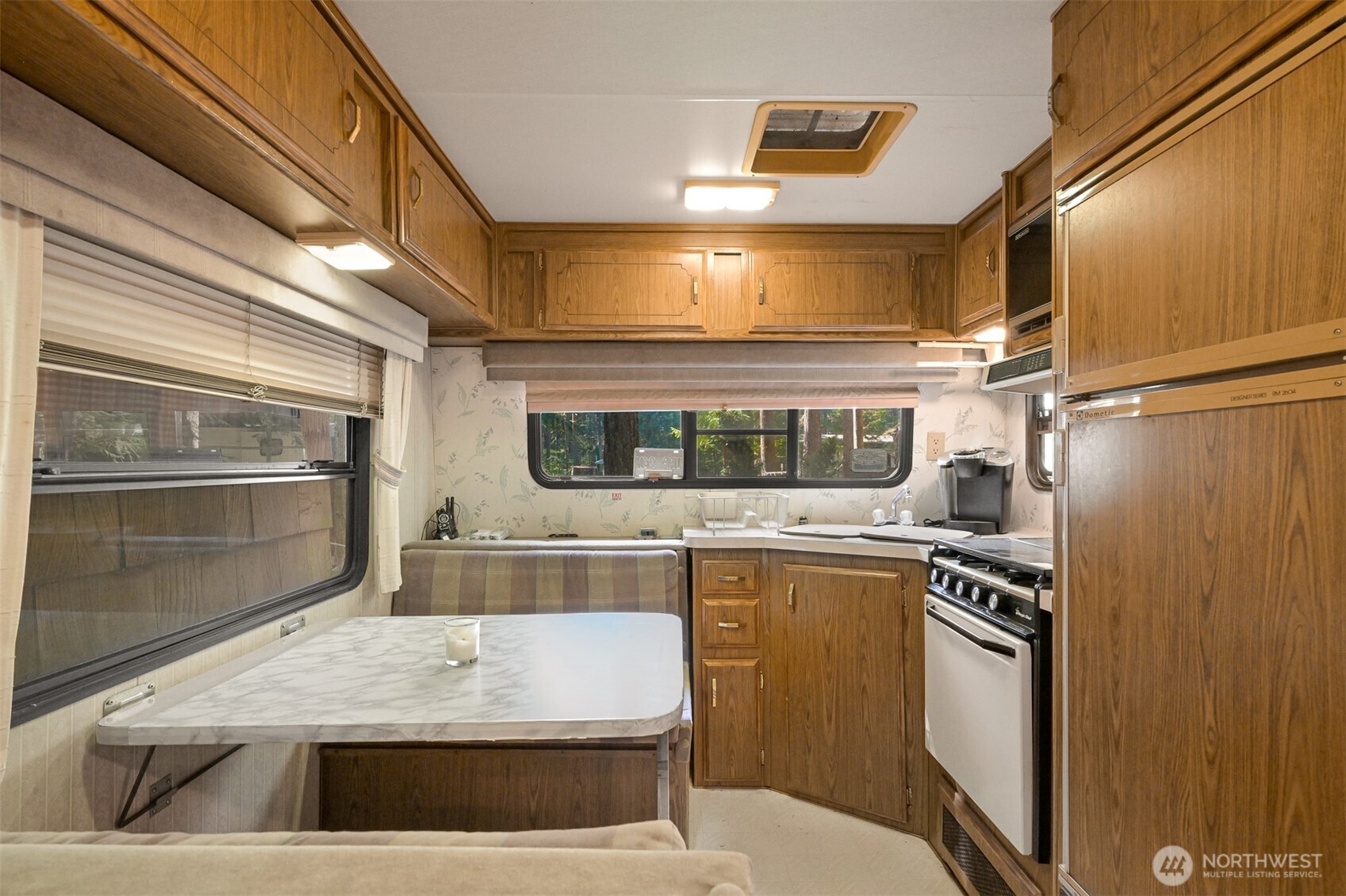 1189 Exit Road Maple Falls, WA 98266 - Photo 17 of 40 a view of a kitchen with a sink and an oven
