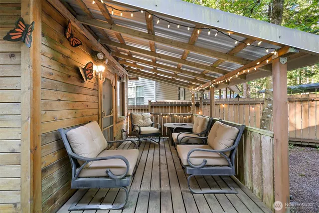 a roof deck with a table and chairs