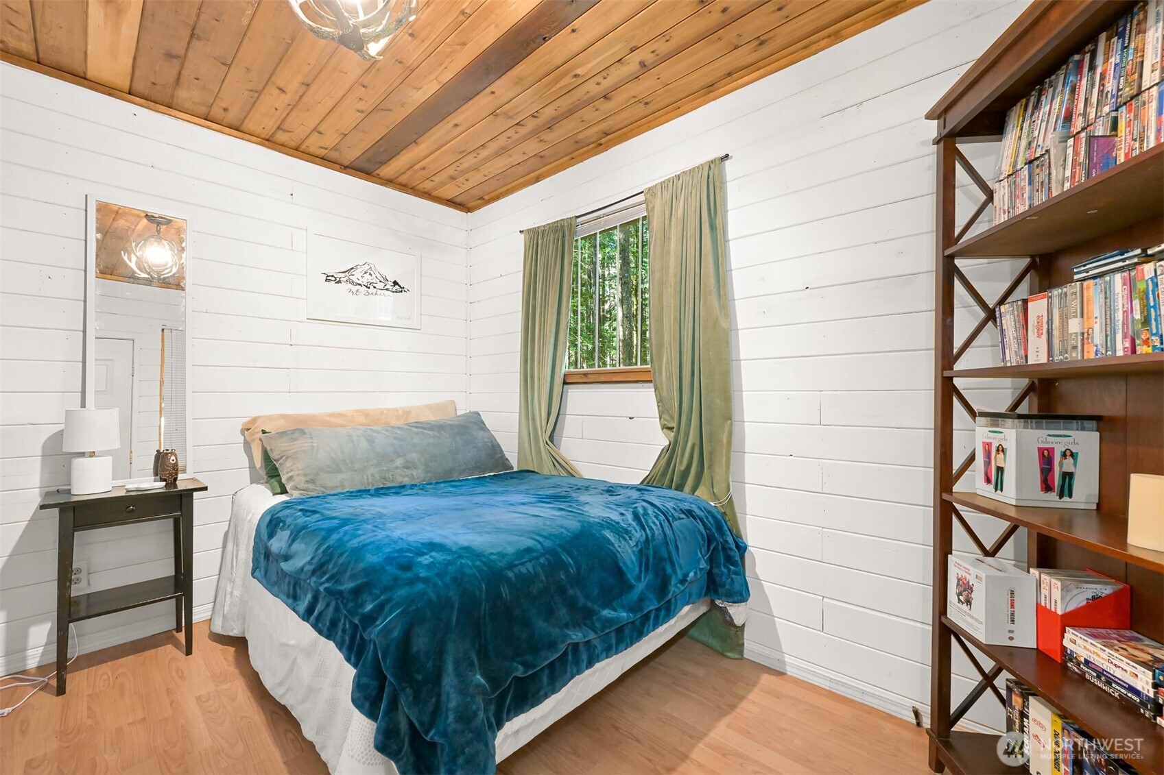 1189 Exit Road Maple Falls, WA 98266 - Photo 6 of 40 a bed sitting in a bedroom next to a window