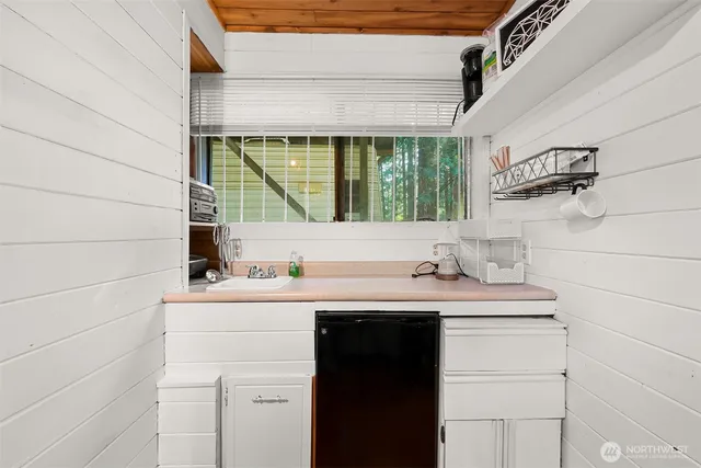 a kitchen with a sink and a window