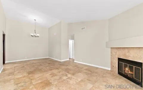 an empty room with a fireplace