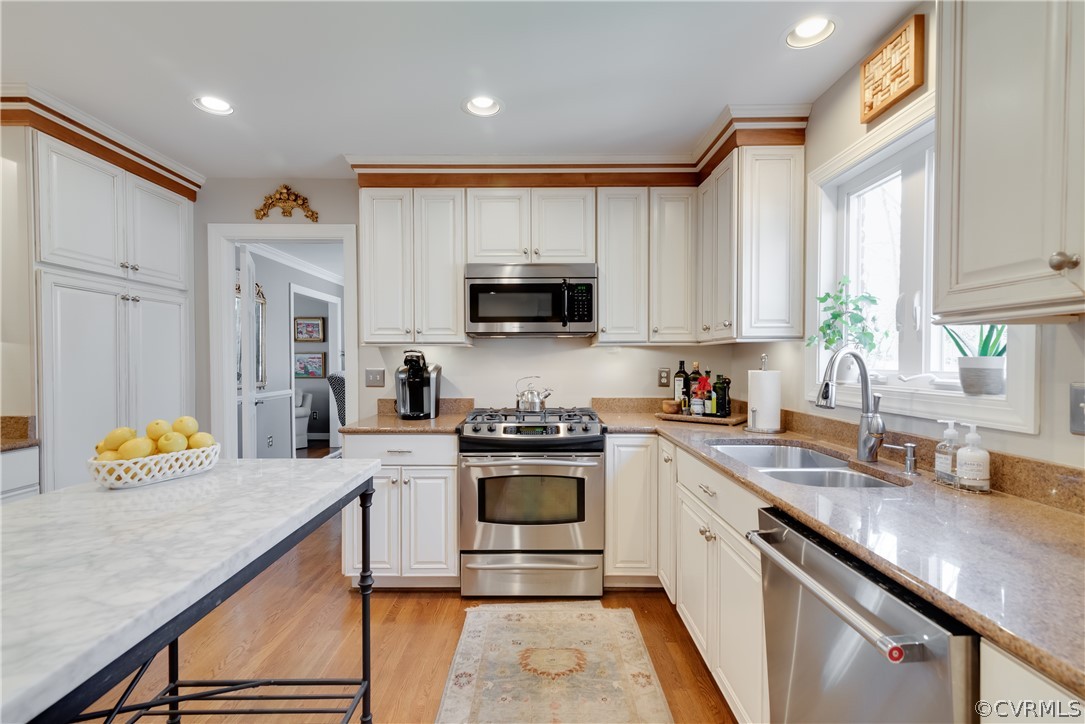 14020 Netherfield Drive Midlothian, VA 23113 - Photo 19 of 50 a kitchen with granite countertop a sink stove and cabinets
