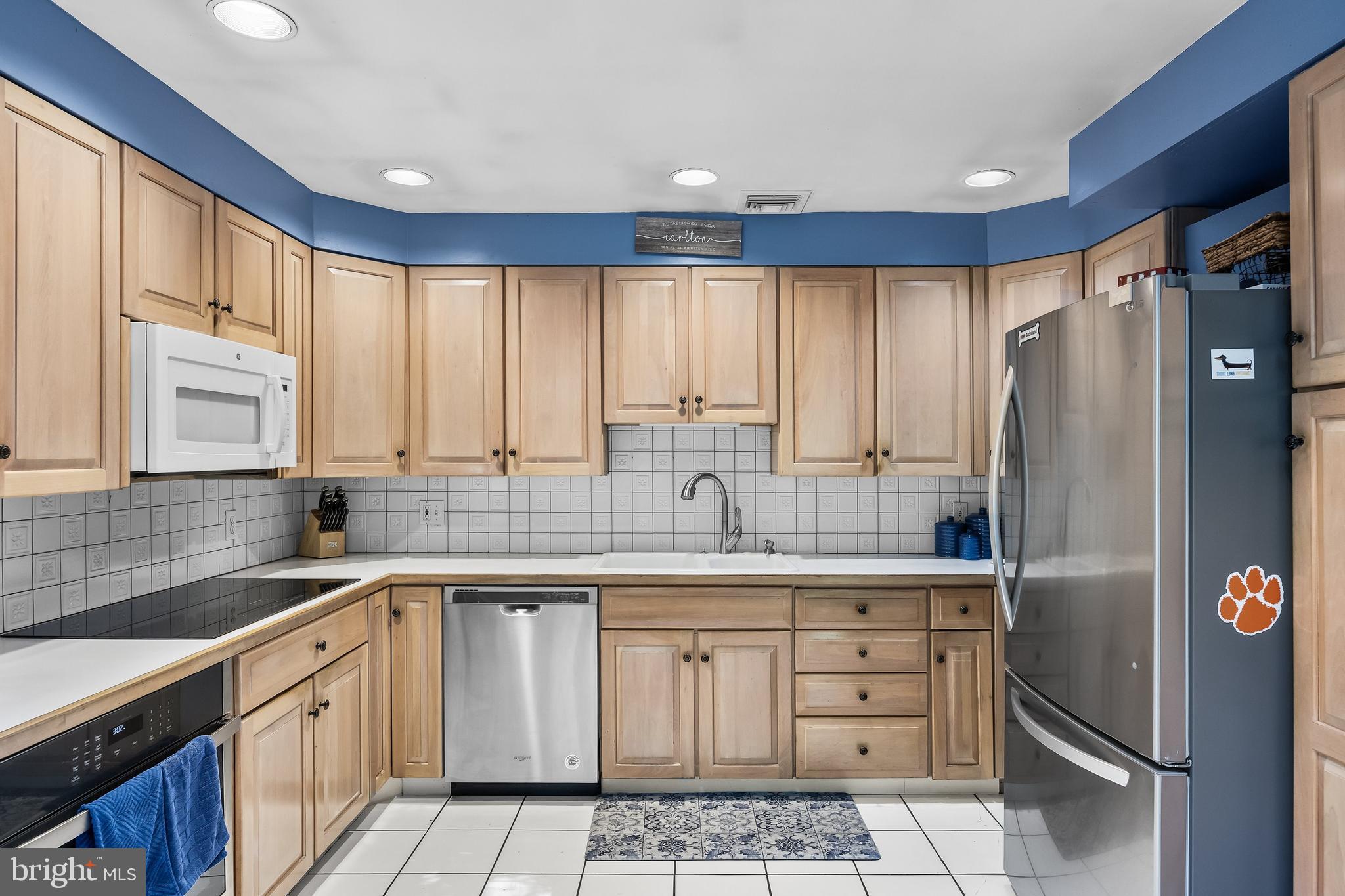 12 Greenvale Road Moorestown, NJ 08057 - Photo 12 of 49 a kitchen with a refrigerator sink and cabinets