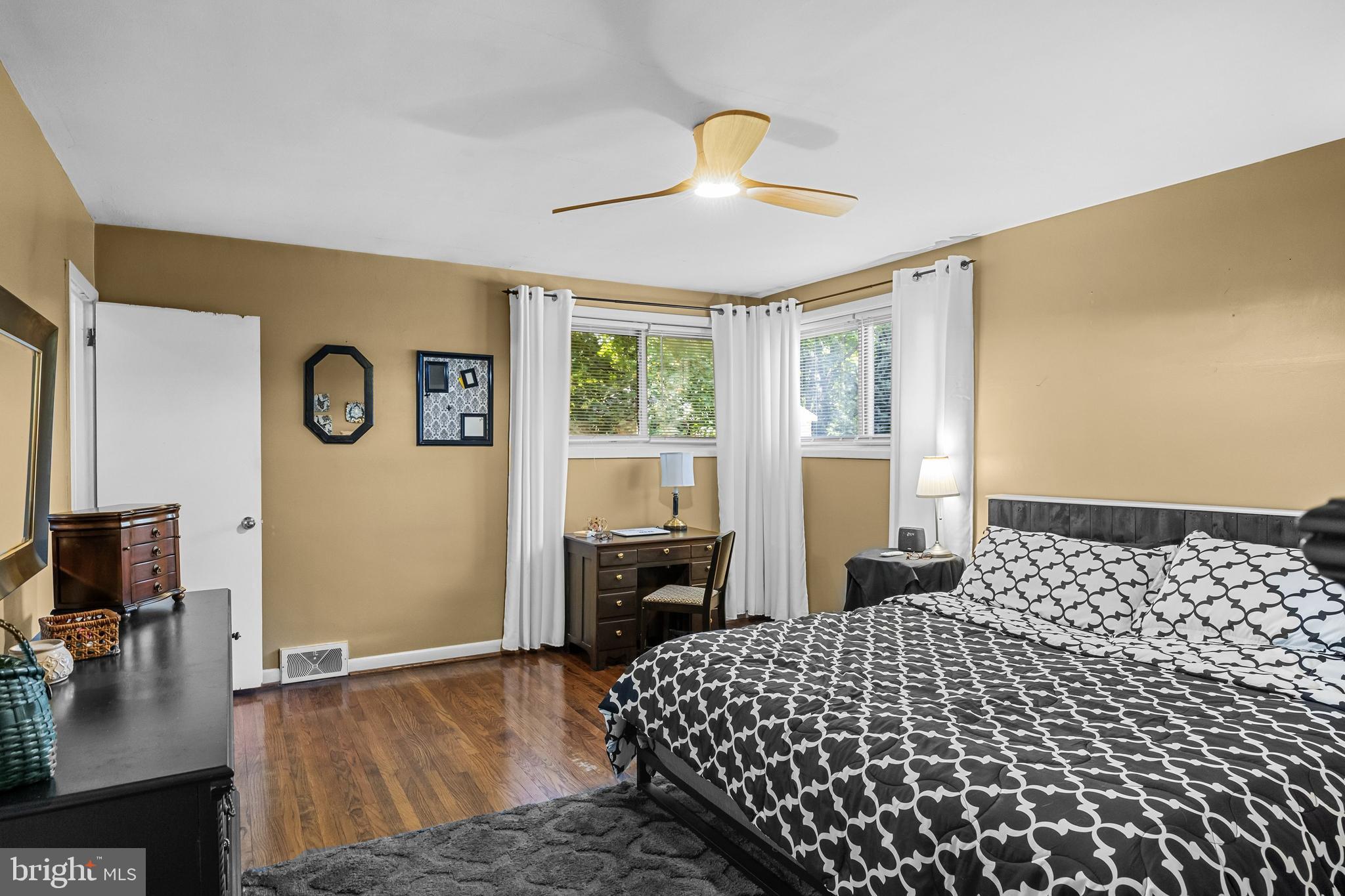 12 Greenvale Road Moorestown, NJ 08057 - Photo 21 of 49 a bedroom with a bed and a flat tv screen on the dresser