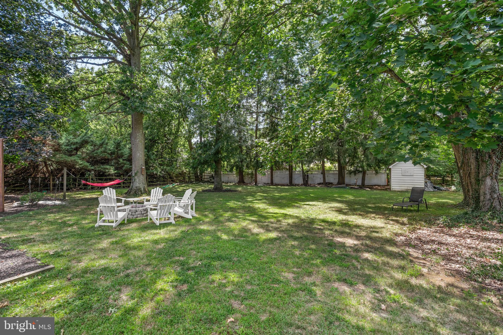 12 Greenvale Road Moorestown, NJ 08057 - Photo 36 of 49 a view of a park with bench and a tree