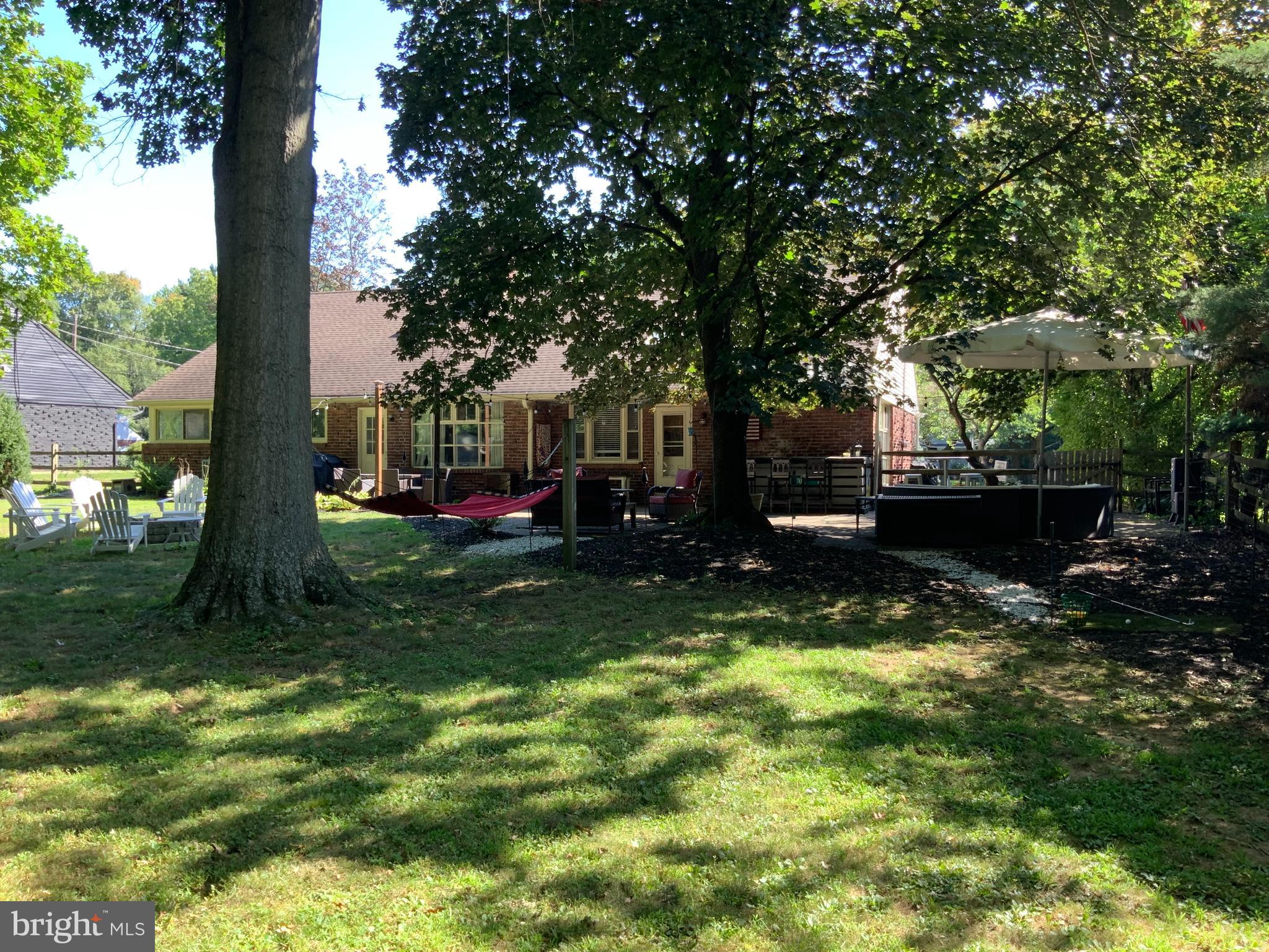 12 Greenvale Road Moorestown, NJ 08057 - Photo 39 of 49 a view of a garden with a tree