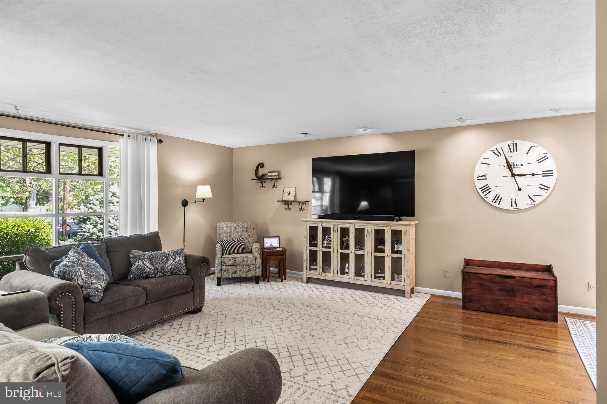 12 Greenvale Road Moorestown, NJ 08057 - Photo 7 of 49 a living room with furniture and a flat screen tv