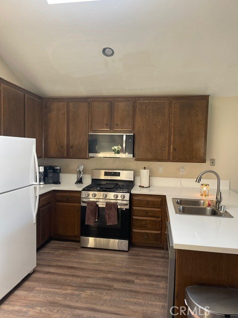 6435 Melray Street Moorpark, CA 93021 - Photo 35 of 41 a kitchen with kitchen island a sink appliances and cabinets