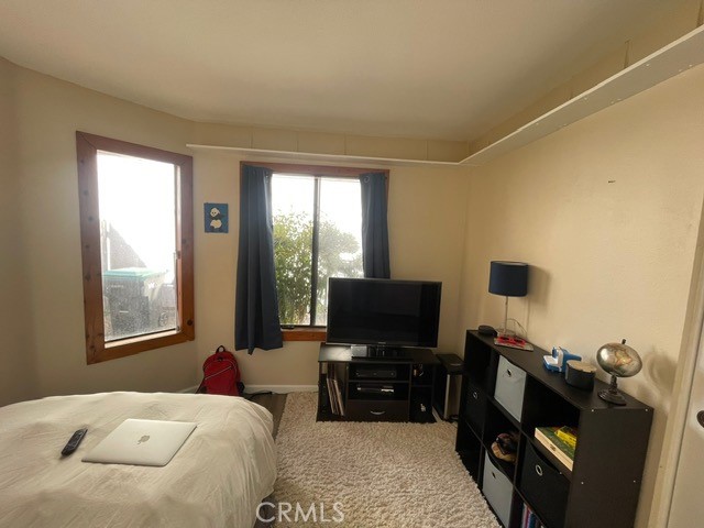 6435 Melray Street Moorpark, CA 93021 - Photo 6 of 41 a bedroom with a bed and flat screen tv