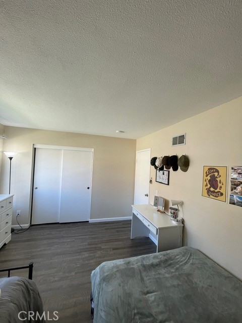 6435 Melray Street Moorpark, CA 93021 - Photo 9 of 41 a bedroom with a bed and cabinets