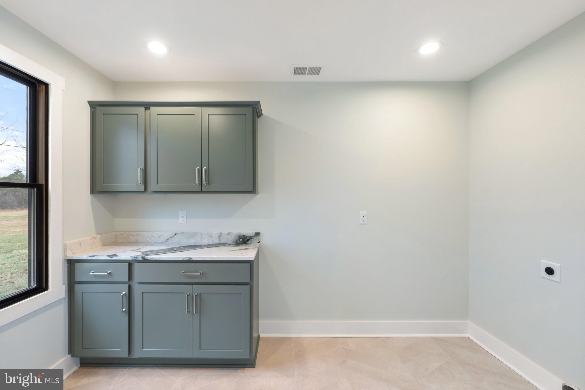 163 Redland Road Cross Junction, VA 22625 - Photo 26 of 53 Large laundry room with cabinets & counter space