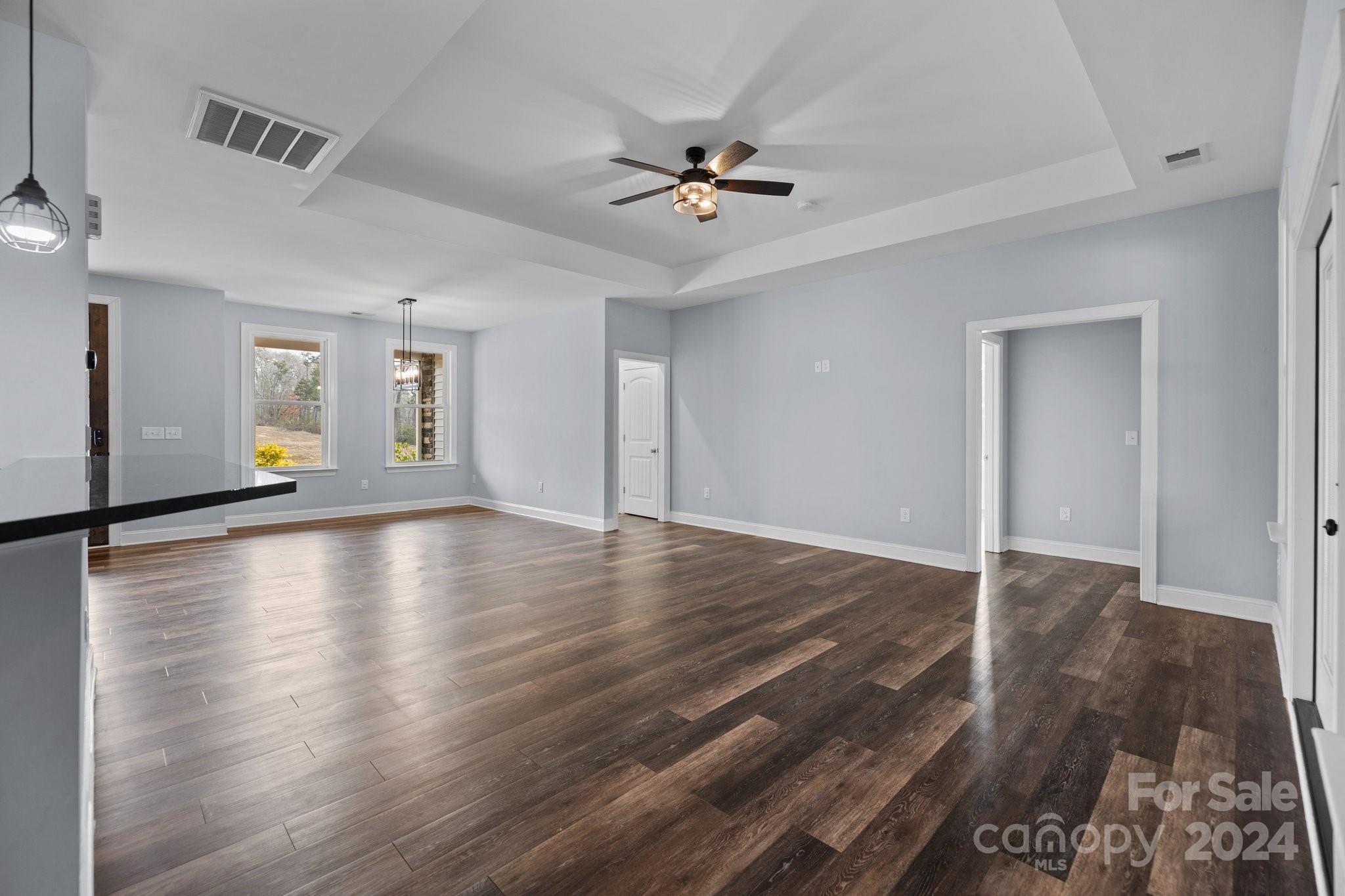3067 Reservation Road Rock Hill, SC 29730 - Photo 16 of 45 a view of an empty room with wooden floor and a ceiling fan