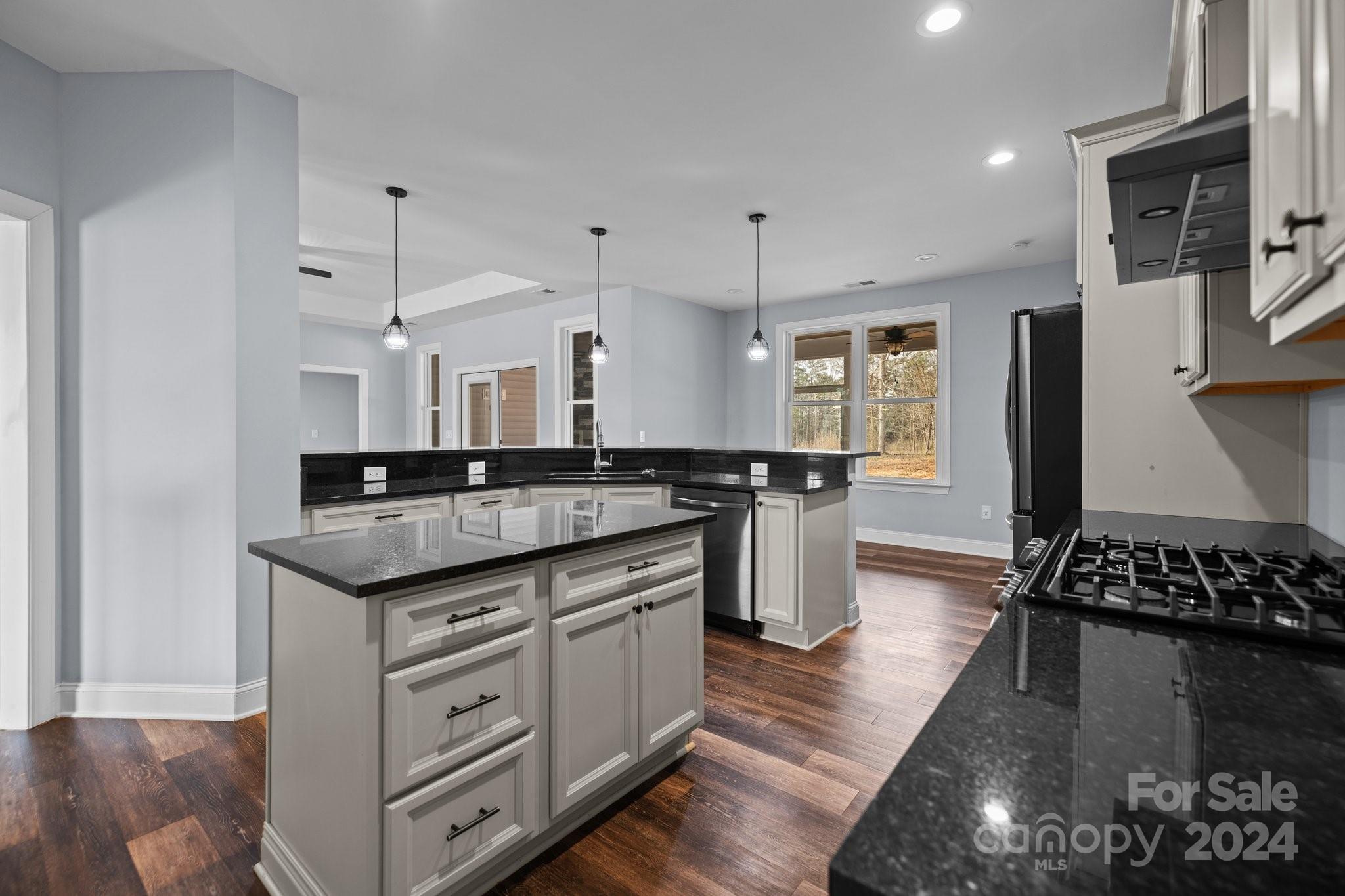 3067 Reservation Road Rock Hill, SC 29730 - Photo 18 of 45 a kitchen with stainless steel appliances granite countertop a stove and a sink