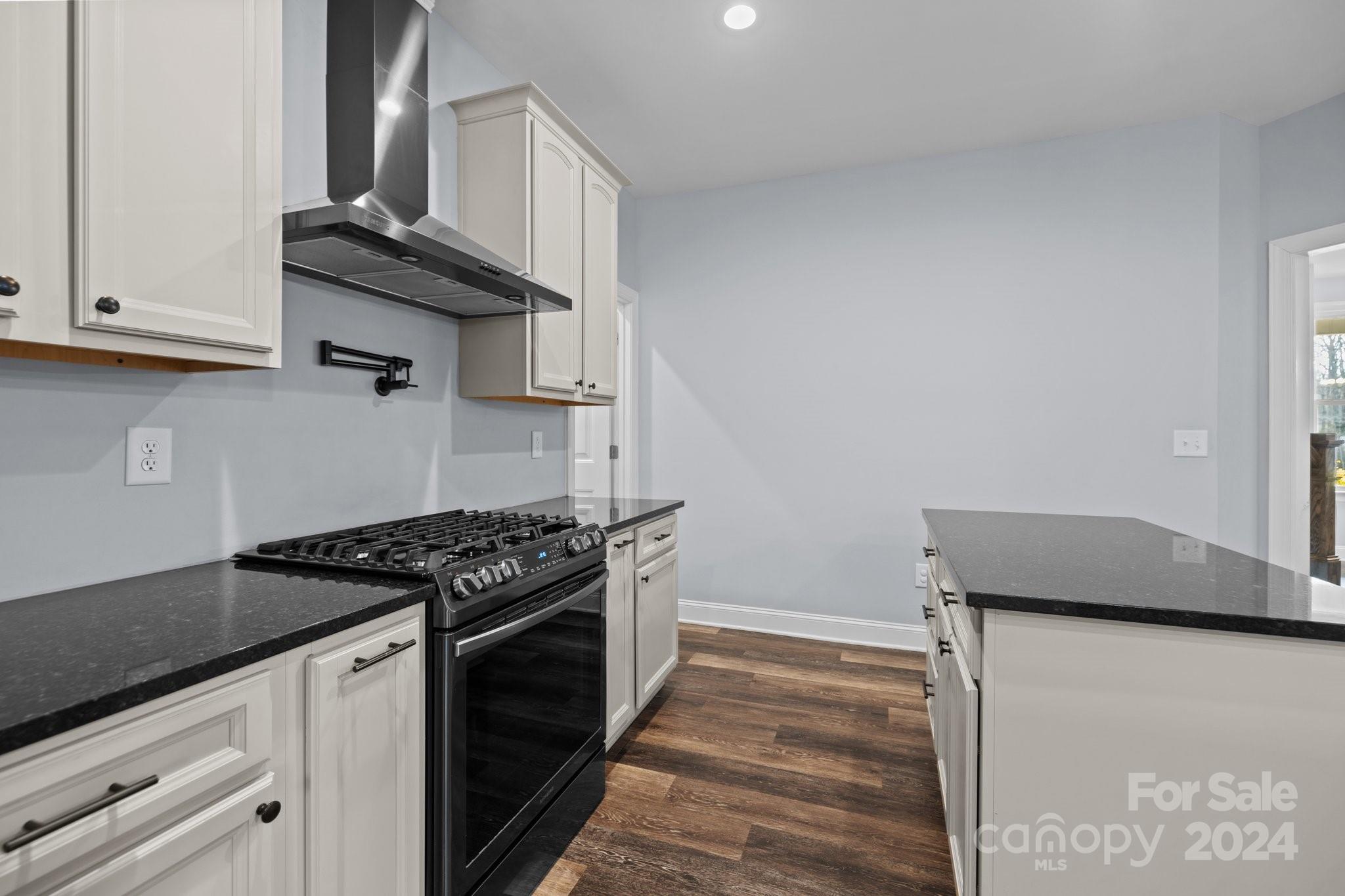 3067 Reservation Road Rock Hill, SC 29730 - Photo 20 of 45 a kitchen with granite countertop a stove and a refrigerator