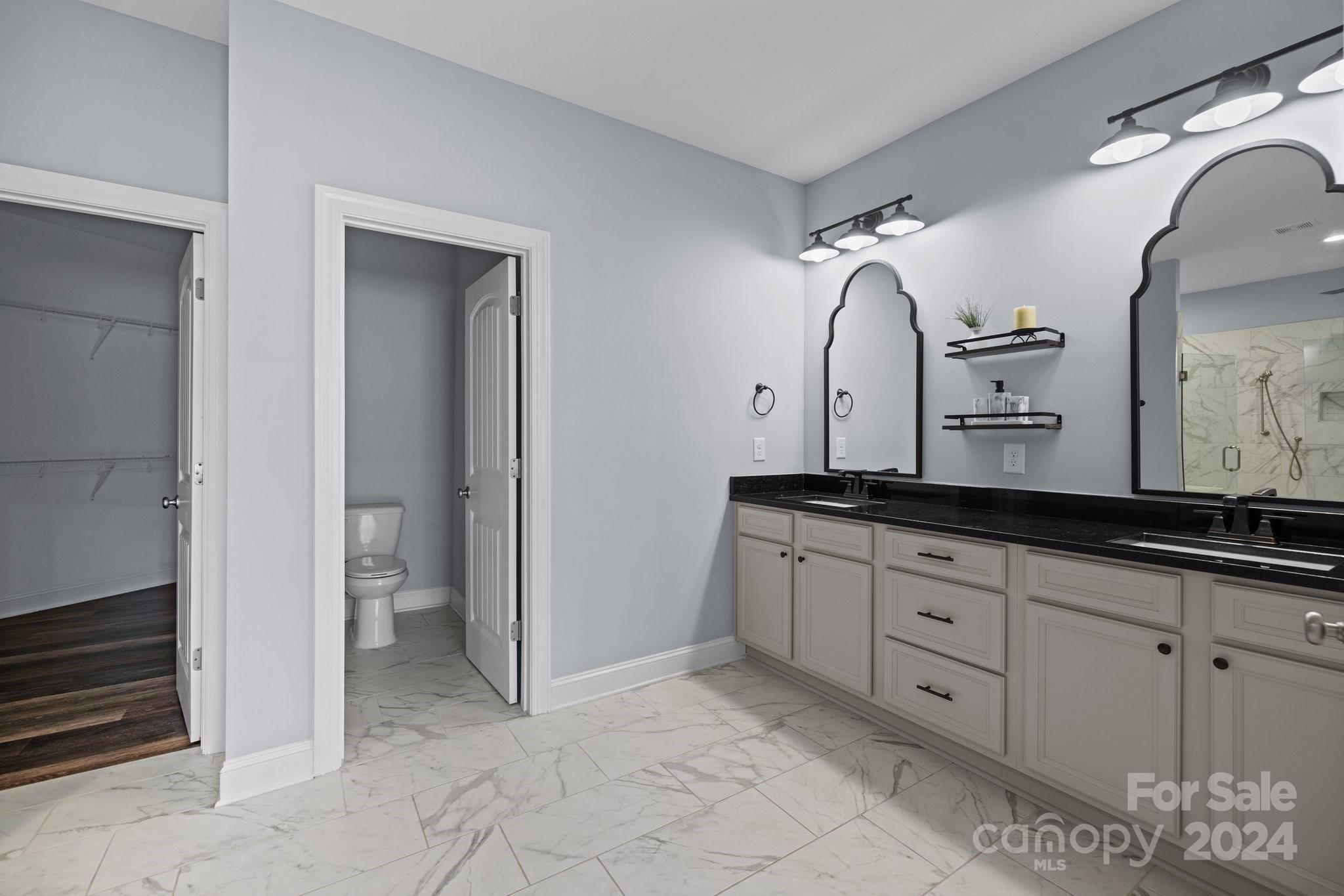 3067 Reservation Road Rock Hill, SC 29730 - Photo 28 of 45 a bathroom with double sink and a mirror