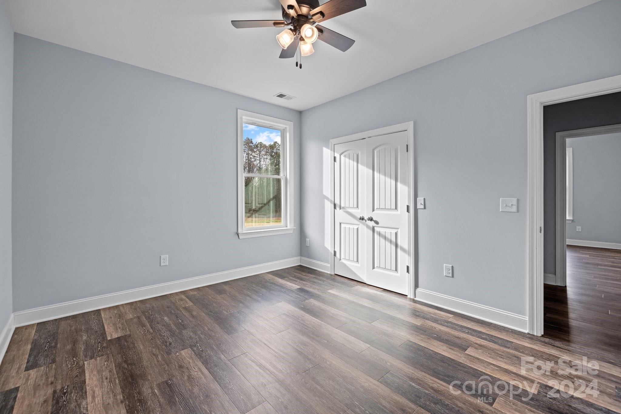 3067 Reservation Road Rock Hill, SC 29730 - Photo 35 of 45 a view of an empty room with a window and wooden floor