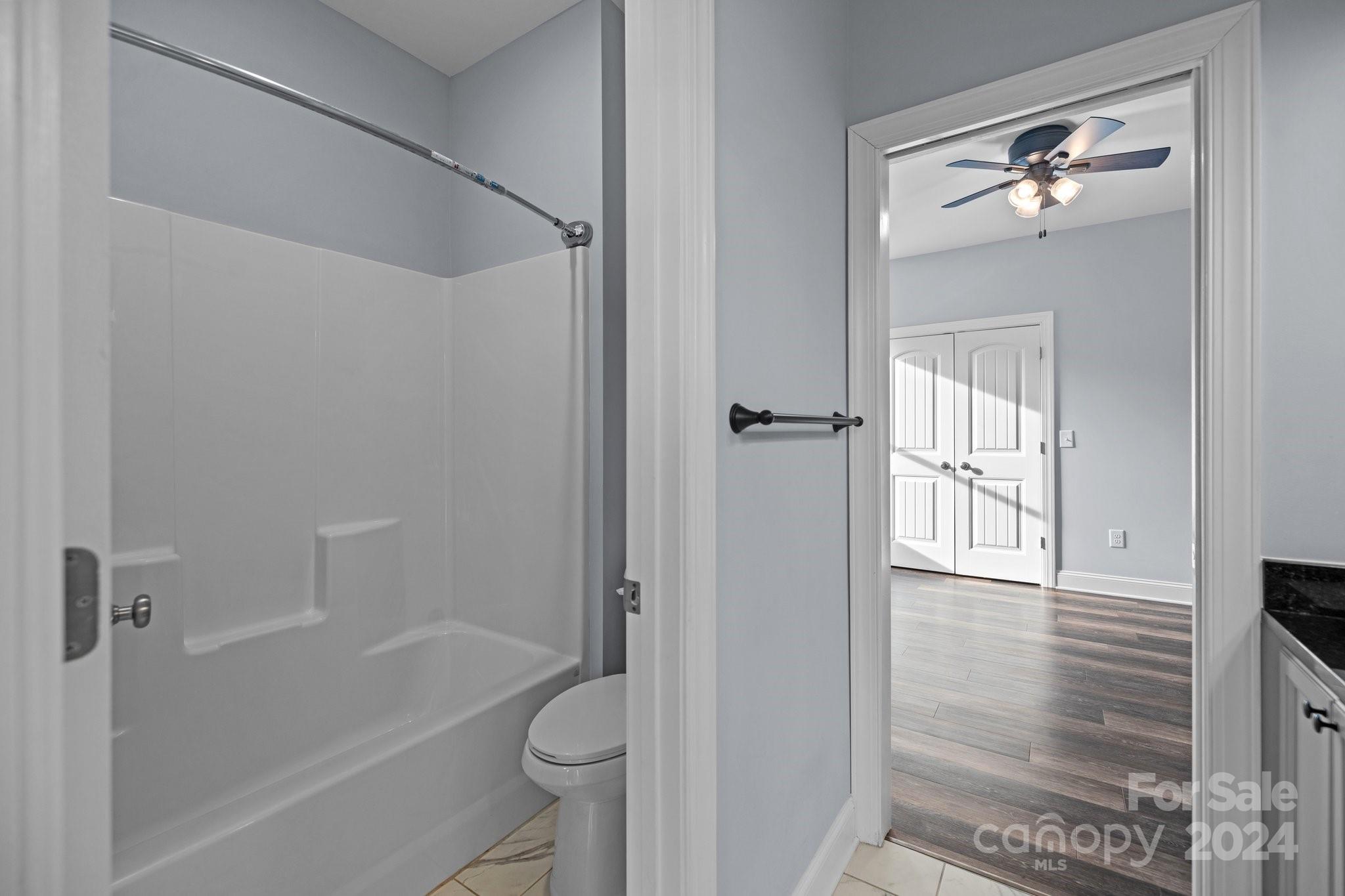 3067 Reservation Road Rock Hill, SC 29730 - Photo 40 of 45 a bathroom with a tub shower sink vanity and a toilet