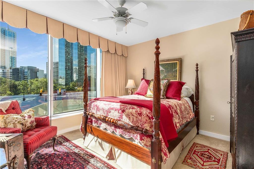 3338 Peachtree Road Northeast, Unit 407 Atlanta, GA 30326 - Photo 13 of 39 a bed room with a bed and a balcony