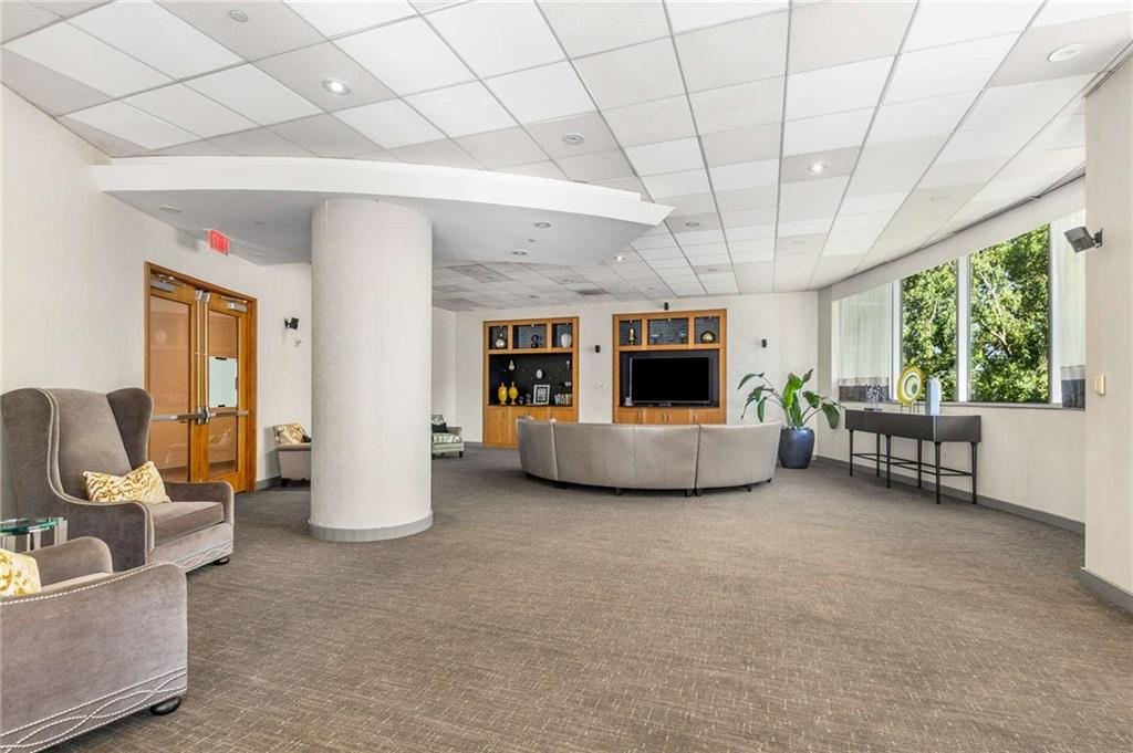3338 Peachtree Road Northeast, Unit 407 Atlanta, GA 30326 - Photo 32 of 39 a view of a livingroom with furniture and a fireplace