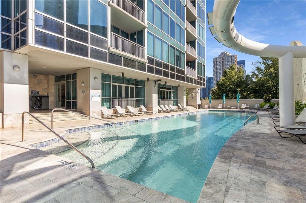 3338 Peachtree Road Northeast, Unit 407 Atlanta, GA 30326 - Photo 36 of 39 a view of a building with a swimming pool