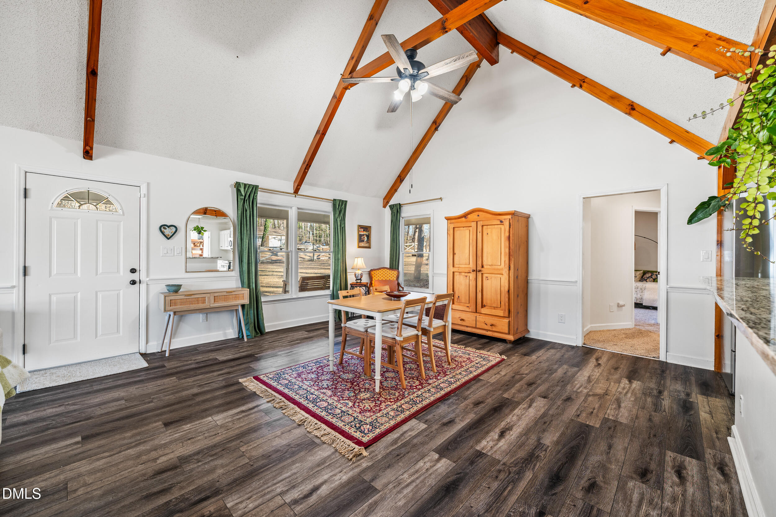2618 Brame Road Greensboro, NC 27405 - Photo 11 of 64 a dining room with wooden floor and large windows